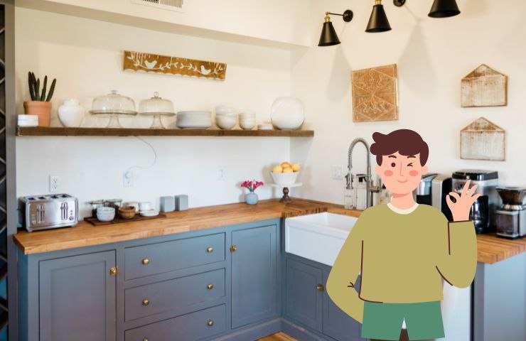 una cucina moderna ed un ragazzo che fa ok